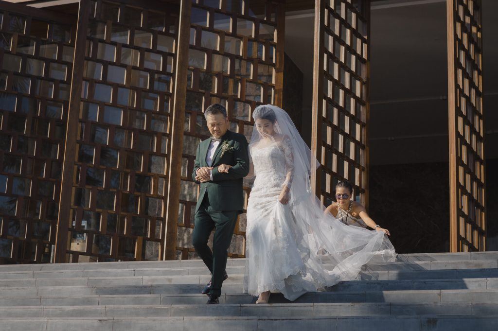 Phuket Thailand wedding photographer captures father walking HK bride down the aisles