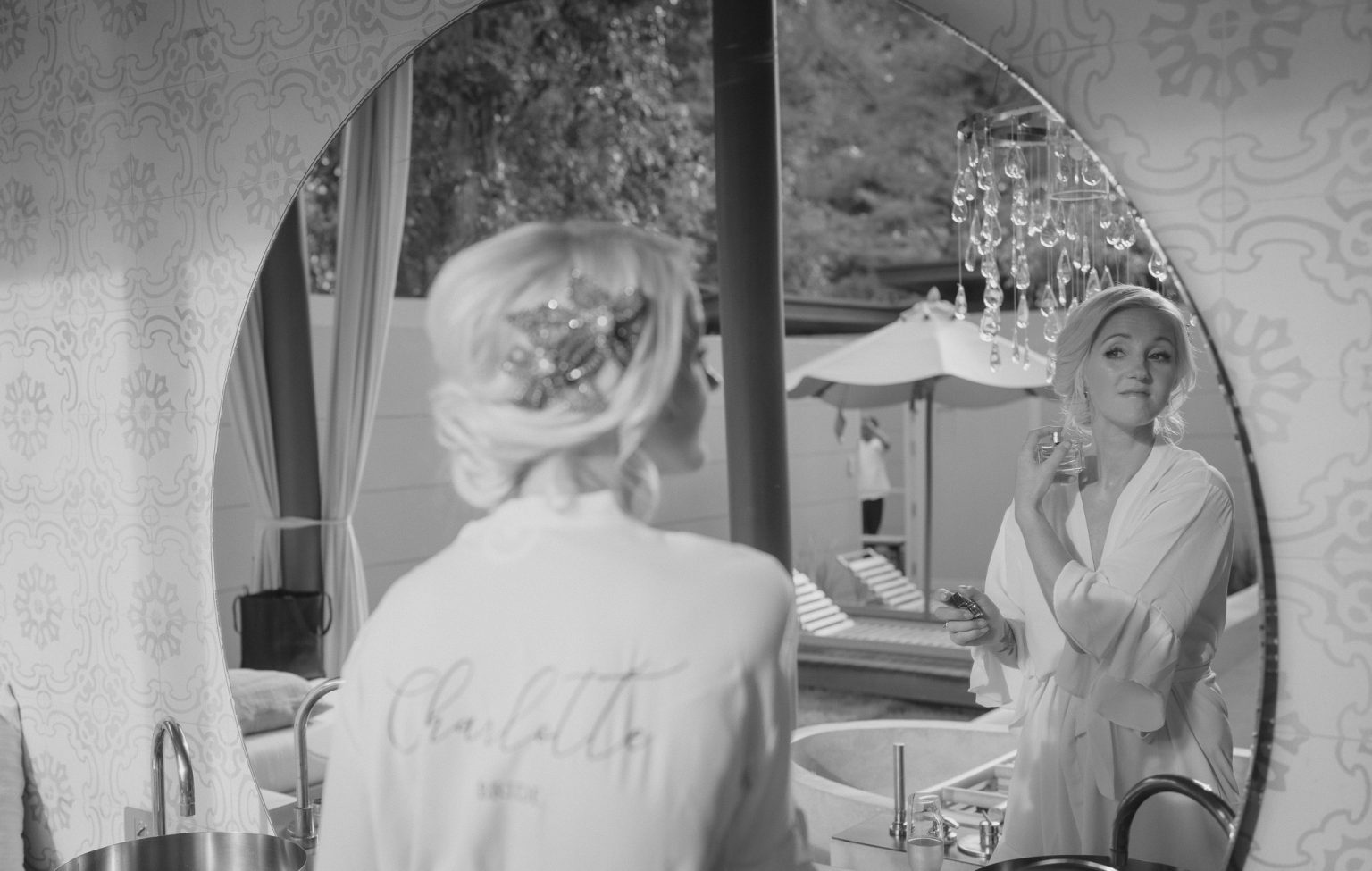 Bride putting her purfume on