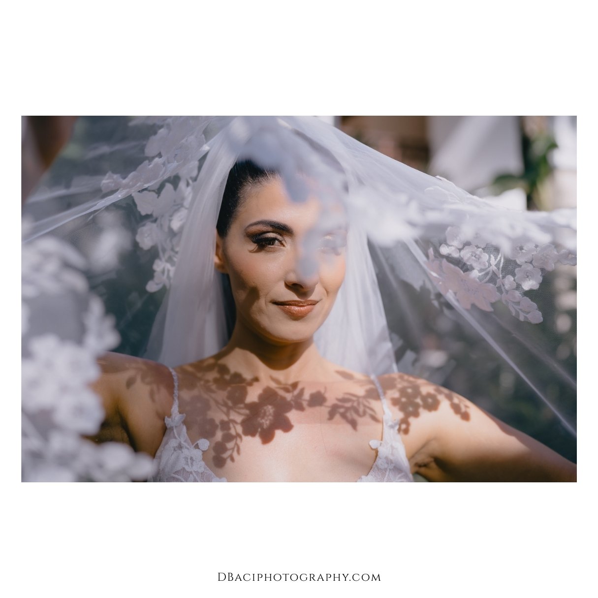 portrait of bride with veil over her had at Thavorn Beach village resort wedding in Phuket