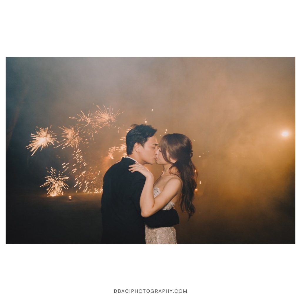 Fire show with bride and groom kissing at Rosewood Hotel Phuket wedding venue