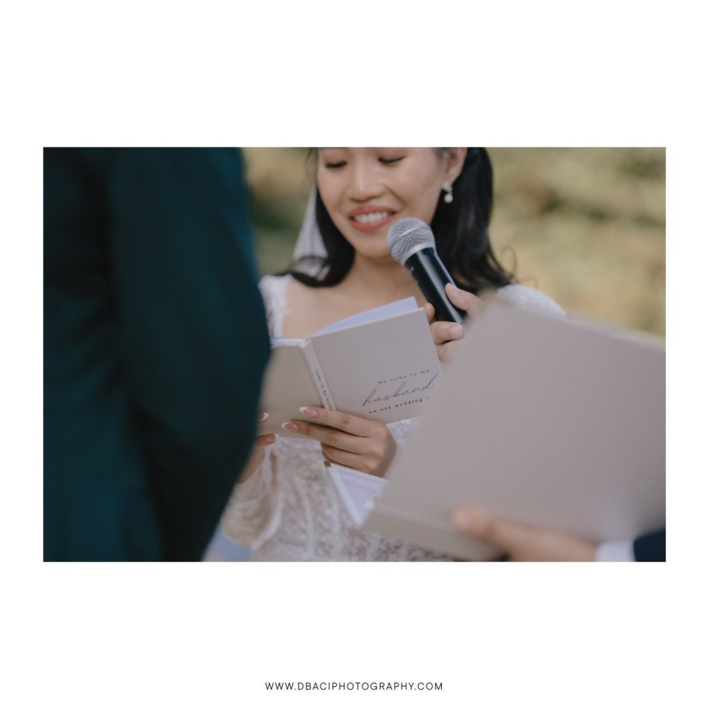 Bride reading her vows at beach wedding venue in Koh Samui, Thailand.