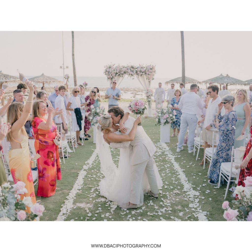 Wedding ceremony kiss at Phuket Marriott Resort & Spa, Merlin Beach.