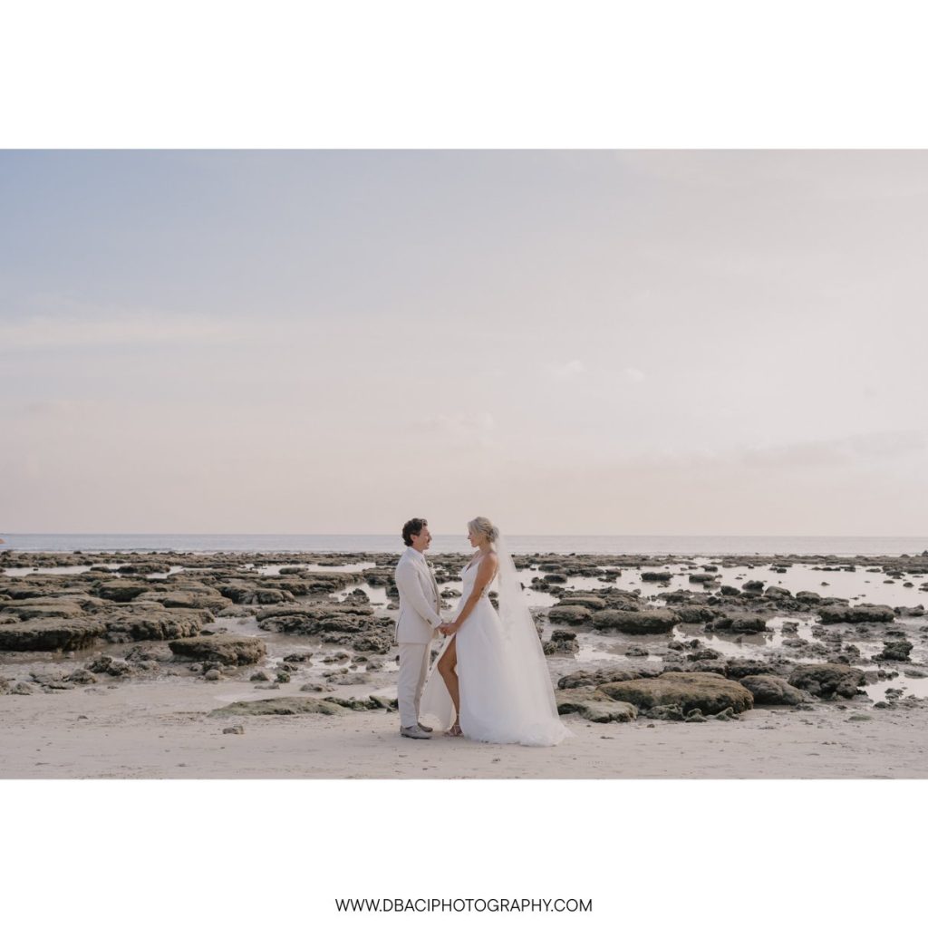 Sunset portrait of bride and groom posing on the beach at the Phuket Marriott Resort & spa, Merlin Beach