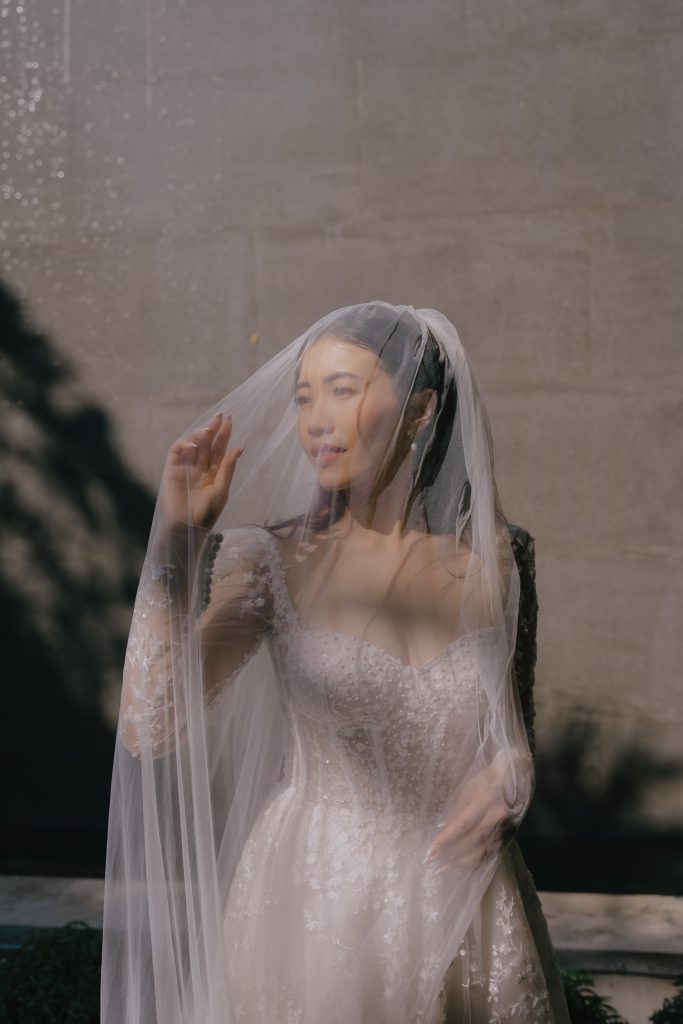 Bride poses for portrait for Koh Samui wedding photographer at Silavadee resort.
