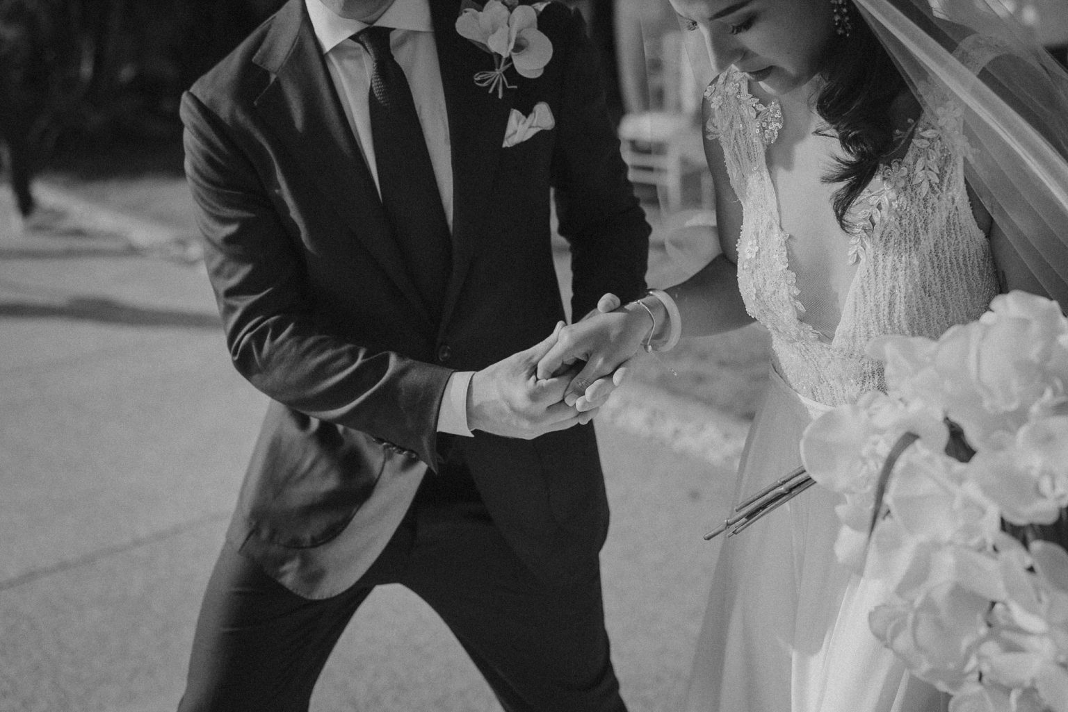 Father handing ober bride to the groom at a beach wedding in the Banyan tree resort