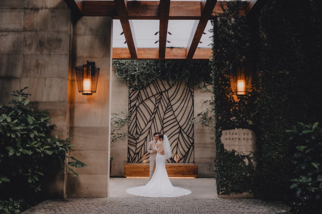 Wedding couple from Hong Kong pose for portrait at Rosewood Hotel in Phuket, Thailand.